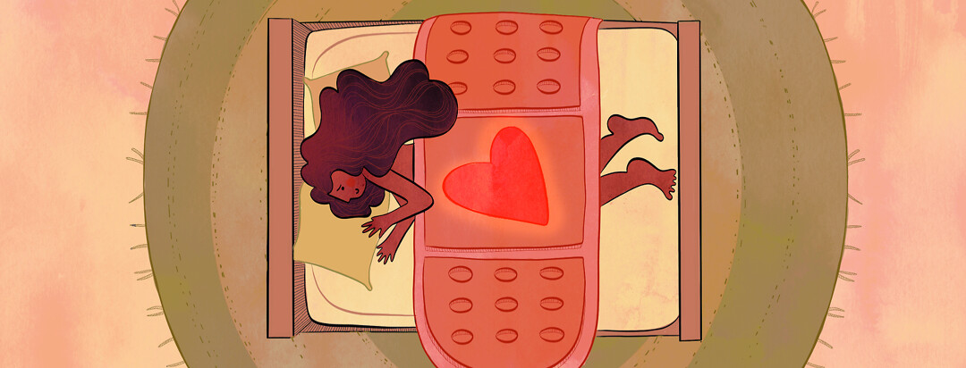 A woman happily lays in her bed with a large blanket in the shape of a bandaid. A glowing heart rests in the middle of the blanket.