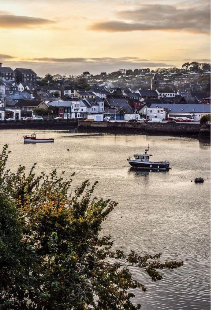 panoramic view of seaside town at sunset