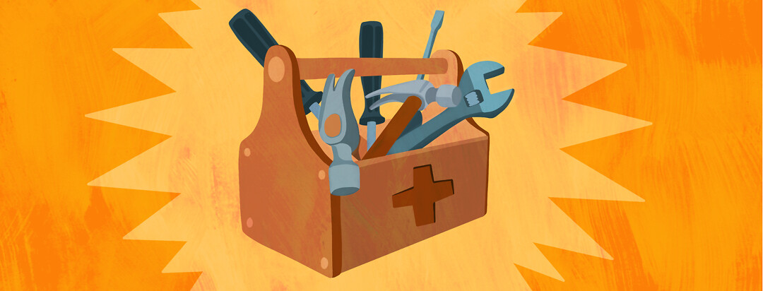 A toolbox with a medical cross on the side and tools spilling out of it.