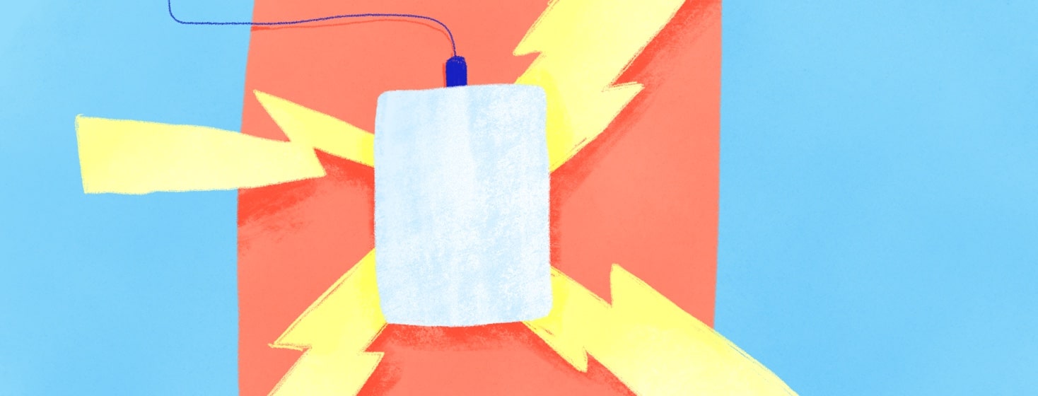 a tens unit on an arm with electricity shooting out