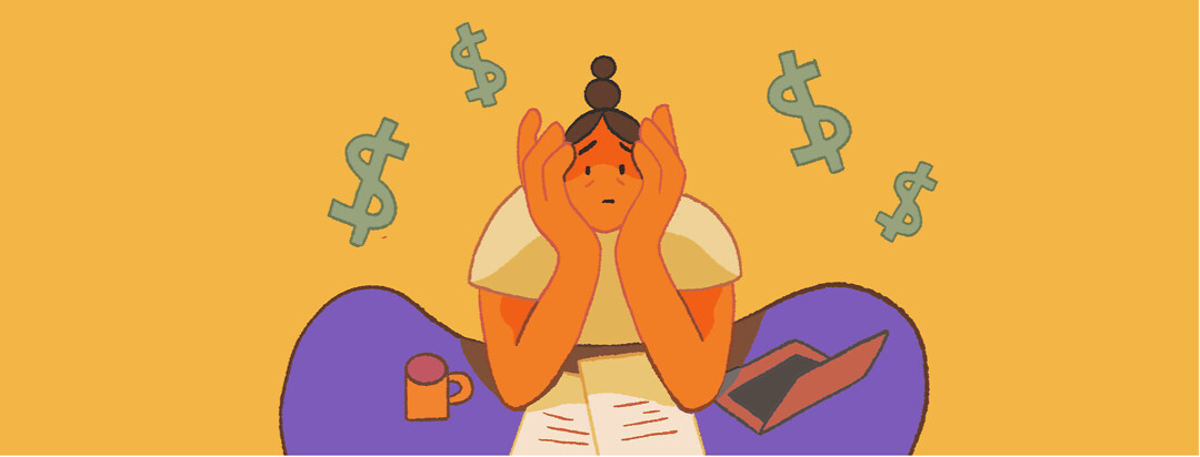 A woman sits at a desk at home and cradles her head in her hands and dollar signs encircle her.