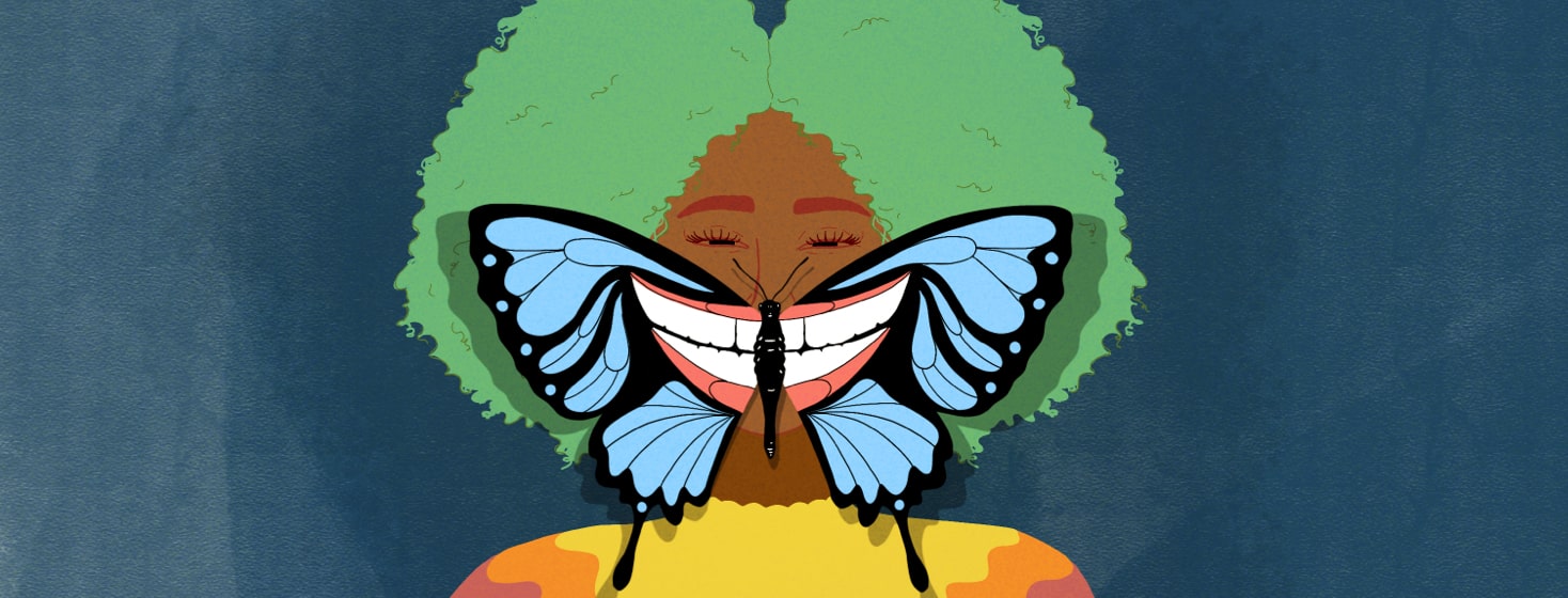 Woman with a smile patterned butterfly on her face